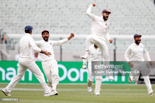 Virat Kohli of India celebrates the last wicket as India defeat Australia on day five of the Third Test match in the series between Australia and...
