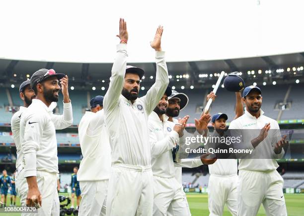 Virat Kohli and his Indian team mates celebrate winning the test during day five of the Third Test match in the series between Australia and India at...