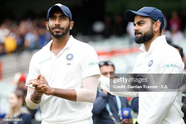 Man of the match Jasprit Bumrah and captain of India Virat Kohli wait to be interviewed at the end of play on day five of the Third Test match in the...