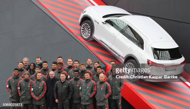 The players of Bayern Munich and Bayern Munich and Audi officials pose for the press at Airport Munich on January 24, 2019 in Munich, Germany. FC...