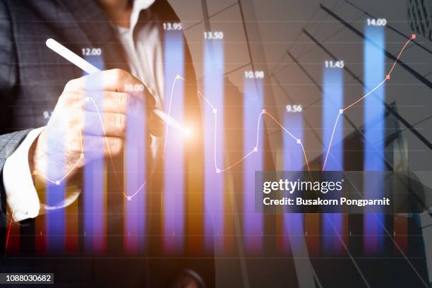 businessman with document in hand drawing abstract business chart on city background with copy space. and business strategy as concept - man double exposure profit concept stock pictures, royalty-free photos & images