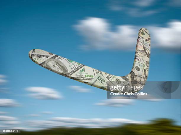 us dollar boomerang flying through the sky - banconota da 20 dollari statunitensi foto e immagini stock