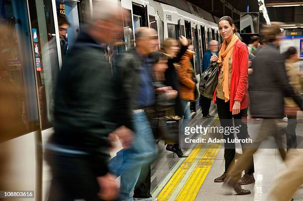 woman in subway - crowded train stock pictures, royalty-free photos & images
