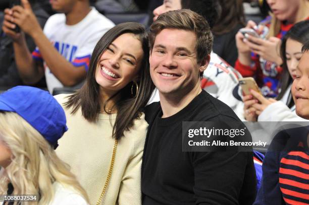 Adam DeVine and Chloe Bridges attend a basketball game between the Los Angeles Clippers and the San Antonio Spurs at Staples Center on December 29,...