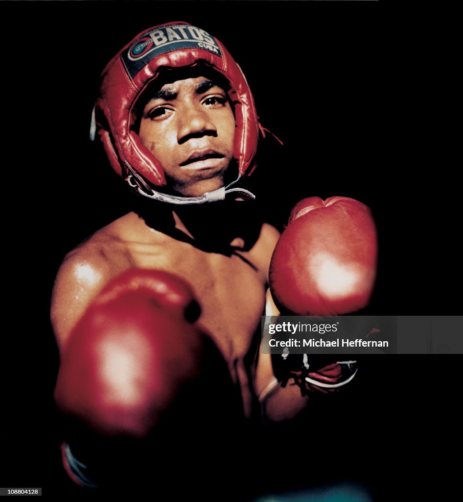 Young boxer in ring in Havana