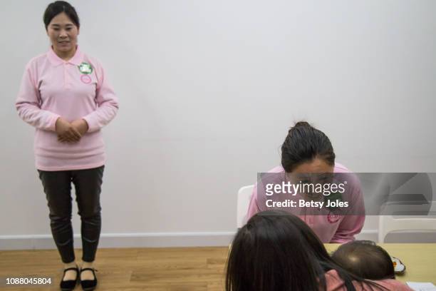 Beijing domestic workers called "ayis" or aunts attend a meet and greet with prospective employers on December 11, 2018 in Beijing, China. In Nov....