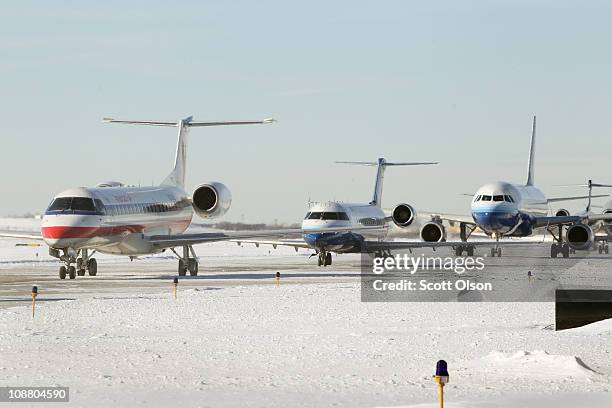 Planes wait in line to take off from O'Hare International Airport February 3, 2011 in Chicago, Illinois. Commercial carriers at the airport started...