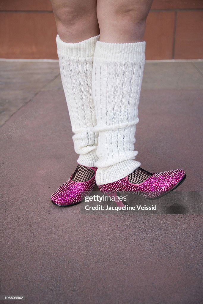 Leg warmers and fancy pink glitter heels