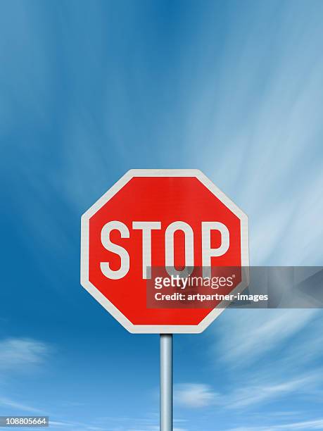 stop - traffic sign with deep blue sky - schild stock-fotos und bilder
