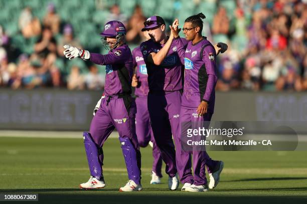 Clive Rose of the Hurricanes celebrates with team mates after taking the wicket of Michael Klinger of the Scorchers during the Big Bash League match...