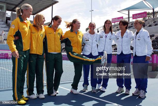 Rennae Stubbs, Anastasia Rodionova, Jarmila Groth and Samantha Stosur of Australia pose with Roberta Vinci, Flavia Pennetta, Francesca Schiavone and...