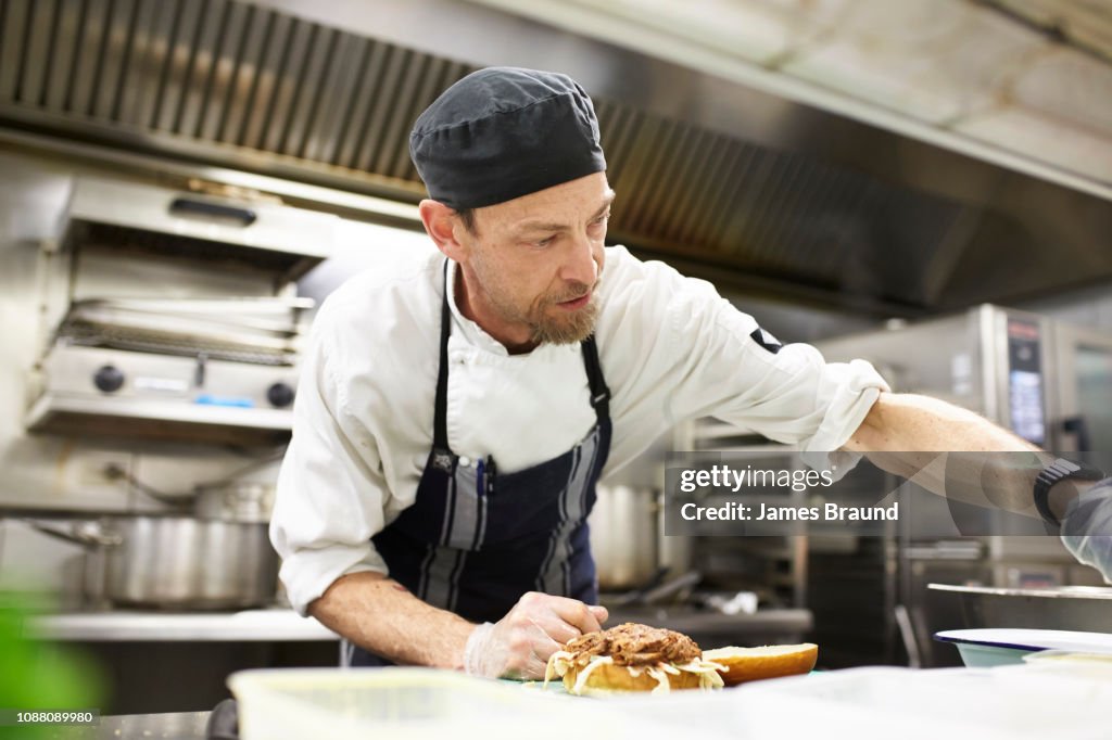 Chef in Kitchen near stove