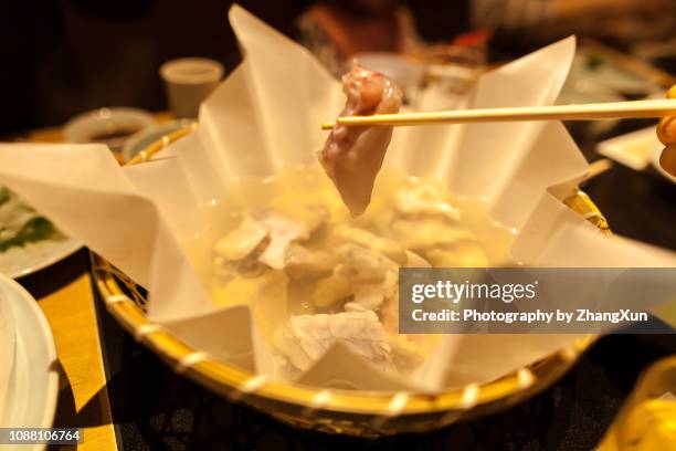 close up view of fugu nabe, tokyo, japan. - puffer fish stock pictures, royalty-free photos & images