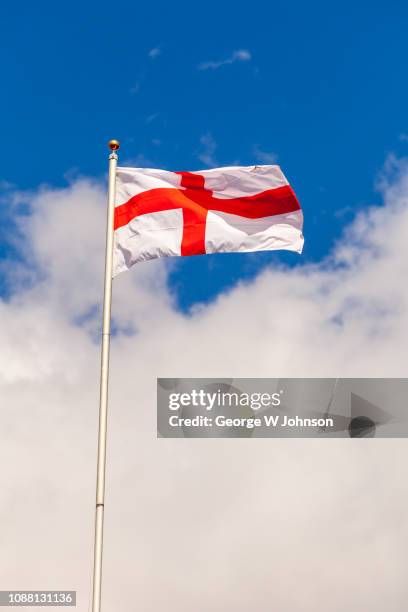 flag of st george in blue sky #3 - england flag stock pictures, royalty-free photos & images