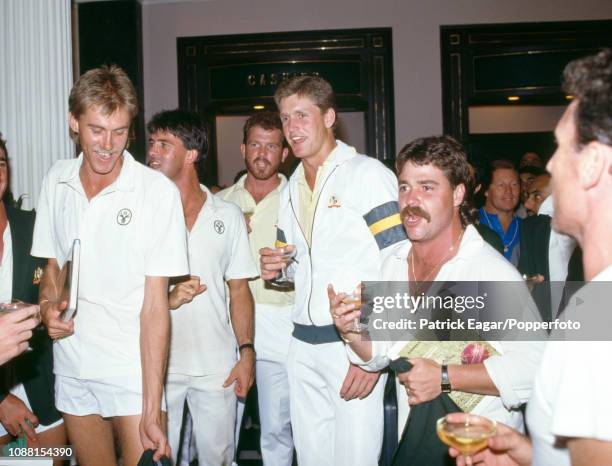 Australian players Bruce Reid, Simon O'Donnell, Craig McDermott, Tom Moody and David Boon sing the team song during a party to celebrate Australia's...