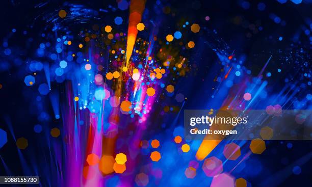 abstract vibrant bokeh sparkling spray circle - celebration event stock pictures, royalty-free photos & images