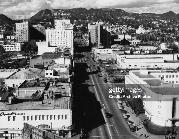 View along Vine Street, Hollywood, Los Angeles, California, 1949. On the hillside in the background is the Hollywood Sign .