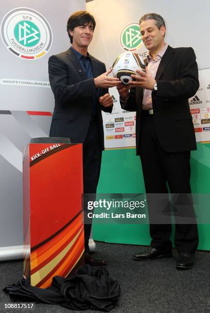 Head coach Joachim Loew hand over the ball of the World Cup round of 16 match between Germany and England to Manuel Neukirchner of DFB football...