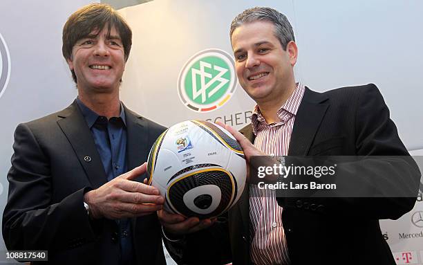 Head coach Joachim Loew hand over the ball of the World Cup round of 16 match between Germany and England to Manuel Neukirchner of DFB football...