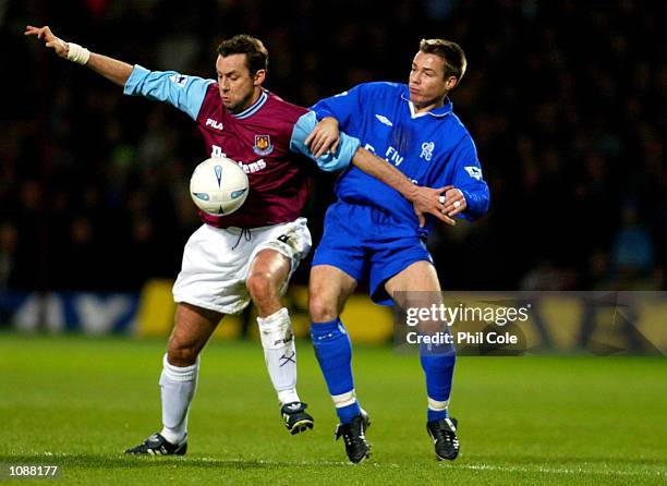 Don Hutchison of West Ham holds off the challenge of Graeme Le Saux of Chelsea during the AXA FA Cup Fourth Round Replay match between West Ham...