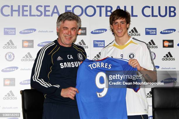 Manager Carlo Ancelotti and Fernando Torres pose for the media at the Chelsea Press Conference on February 4, 2011 in Cobham, England.