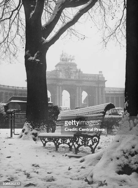 View of the triumphal arch on a snowy day in the Parc du Cinquantenaire, Brussels, 4th November 1966.