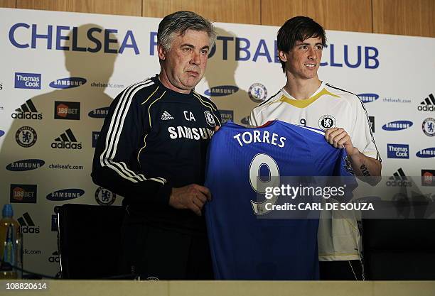 Chelsea's Italian Manager Carlo Ancelotti and Chelsea's new signing, Spanish striker Fernando Torres attend a press conference at Chelsea's training...