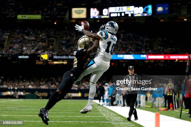 Ken Crawley of the New Orleans Saints breaks up a pass intended for Curtis Samuel of the Carolina Panthers during the first half during a NFL game at...