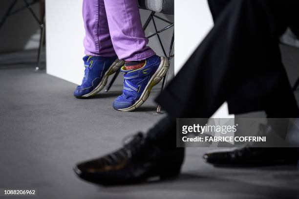 Swedish youth climate activist Greta Thunberg's baskets are seen while she delivers a speech during the closing day of the World Economic Forum...