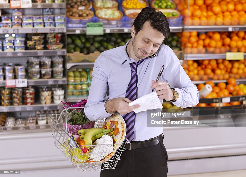 Business man checking shopping list