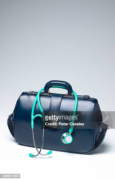 doctors bag with copy space - arzt koffer stock-fotos und bilder