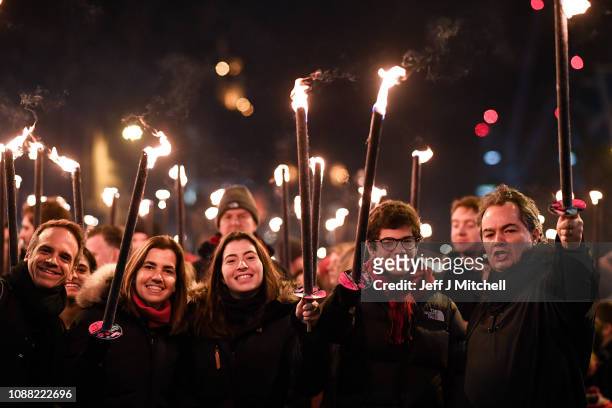 Members of the public take part during the torchlight procession as it makes its way down the Royal Mile for the start of the Hogmanay celebrations...