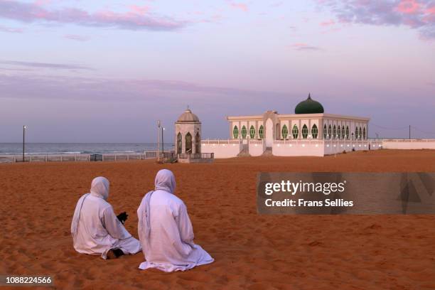 praying time at the mausoleum of seydina limamou laye on yoff  beach, dakar, senegal - dakar senegal bildbanksfoton och bilder