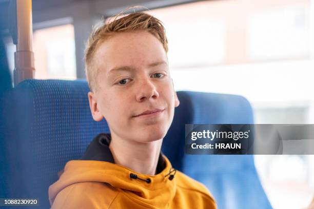 teenage boy traveling by bus - bus denmark stock pictures, royalty-free photos & images