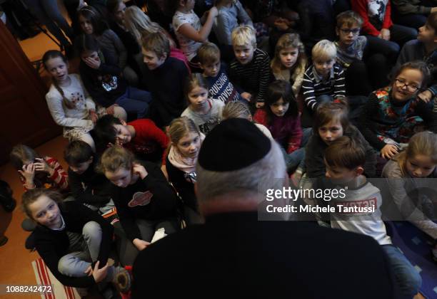 Rabbi Walter Rotschild speaks to Schoolchildren attending the unveiling of a memorial of tiles decorated with butterflies dedicated to Jewish...