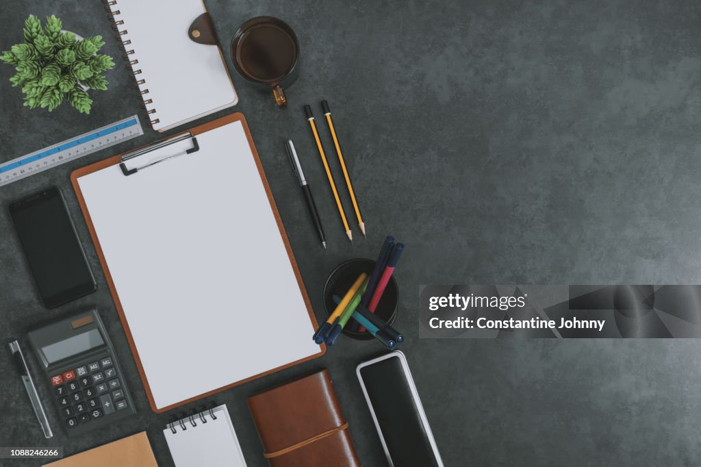 Office Supply Items on Dark Gray Background