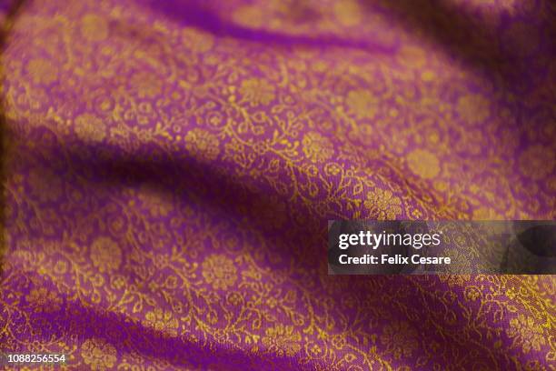 a full frame of colourful indian silk - silk sari stock pictures, royalty-free photos & images