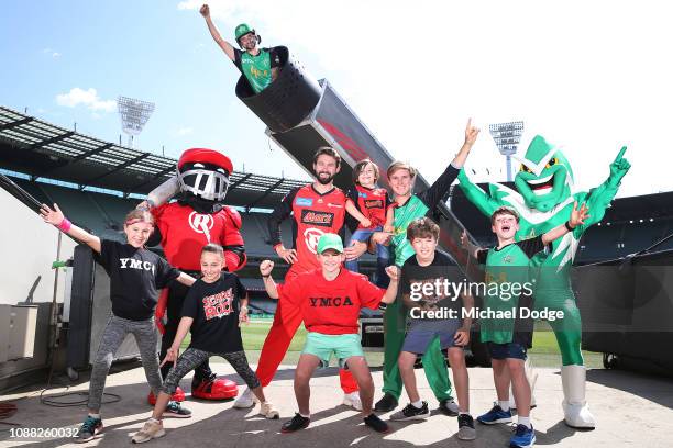 Melbourne Renegades player Kane Richardson and Melbourne Stars player Adam Zampa pose with YMCA and School Of Rock kids in front of the giant Human...