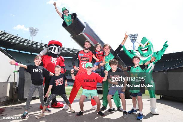 Melbourne Renegades player Kane Richardson and Melbourne Stars player Adam Zampa pose with YMCA and School Of Rock kids in front of the giant Human...