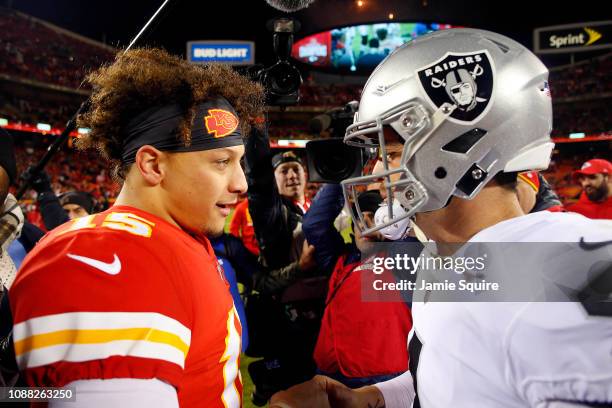 Quarterback Patrick Mahomes of the Kansas City Chiefs greets quarterback Derek Carr of the Oakland Raiders after the Chiefs defeated the Raiders 35-3...