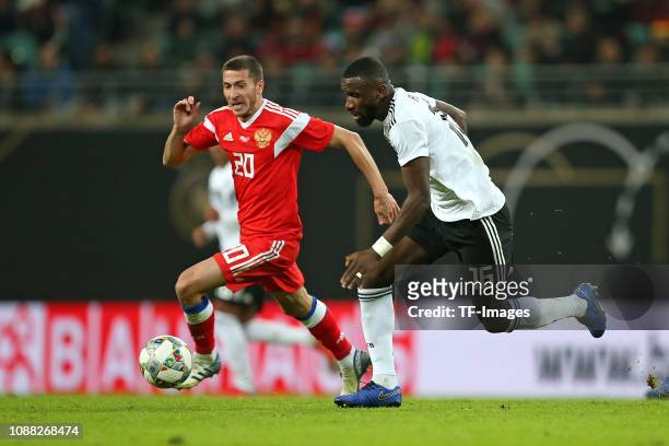 Aleksei Ionov of Russia and Antonio Ruediger of Germany battle for the ball during the International Friendly match between Germany and Russia at Red...