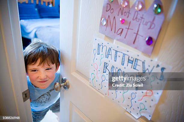 small boy opening bedroom door only slightly - open day 5 stock pictures, royalty-free photos & images