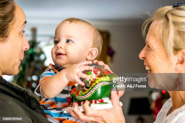 young baby boy playing. - godparent stock pictures, royalty-free photos & images