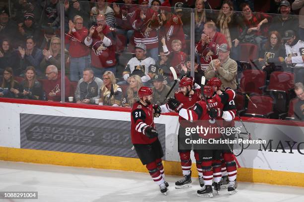 Alex Galchenyuk of the Arizona Coyotes celebrates with Derek Stepan, Clayton Keller and Oliver Ekman-Larsson after scoring a power-play goal against...