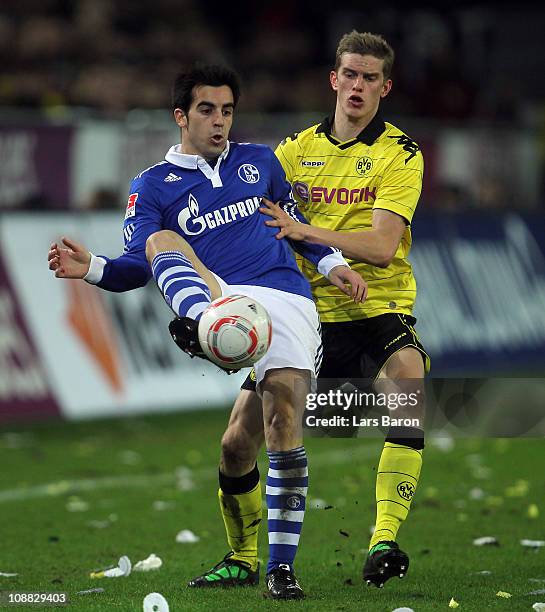 Manuel Jurado of Schalke is challenged by Sven Bender of Dortmund during the Bundesliga match between Borussia Dortmund and FC Schalke 04 at Signal...