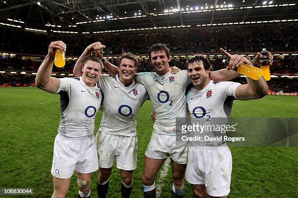 England and Northampton teammates Chris Ashton, Dylan Hartley, Tom Woods and Ben Foden celebrate following their team's victory during the RBS 6...