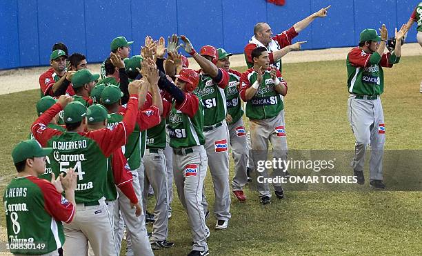 The entire Mexican team celebrates the three runs and a hit of Agustin Murillo during the fifth inning of the Caribbean Baseball Series game againts...