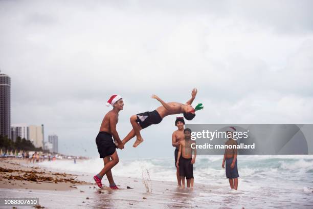 5 brothers at the beach for summer christmas - fraternity brother stock pictures, royalty-free photos & images