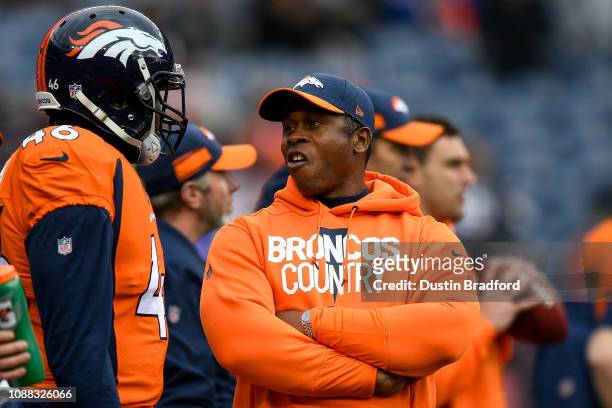 Head coach Vance Joseph of the Denver Broncos has a word with linebacker Jeff Holland before a game against the Los Angeles Chargers at Broncos...