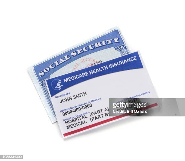 medicare health insurance card and social security card: white background - playing card stock pictures, royalty-free photos & images